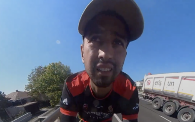 Chilean traveler Diego Haro is seen biking in a report published online by Spanish-language broadcaster TRT Espanol on June 25, 2025. (Screen capture: X/TRT Espanol)